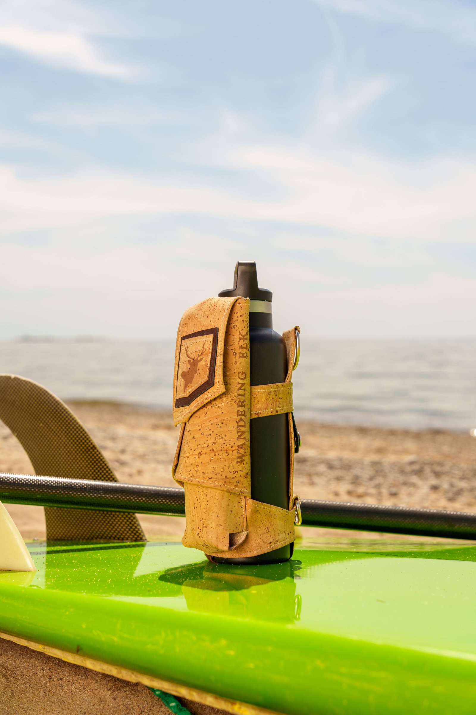 Wandering Elk bottle harness on a surfboard